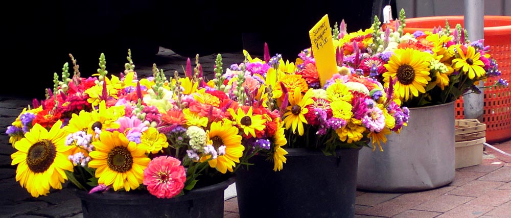 flowers in buckets at the market
