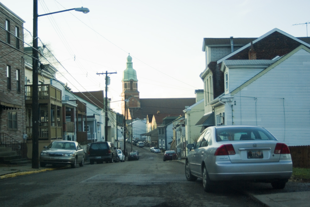 photo of narrow street with church