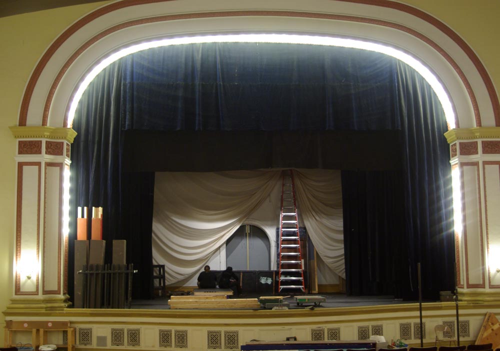 people on stage building set