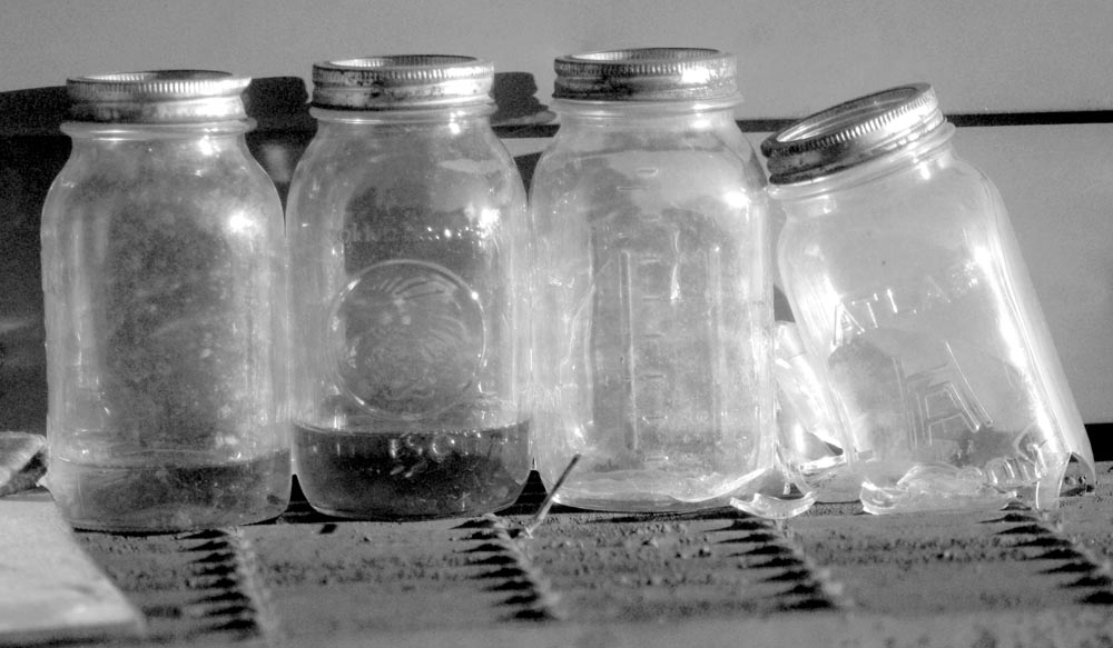 four glass bottles