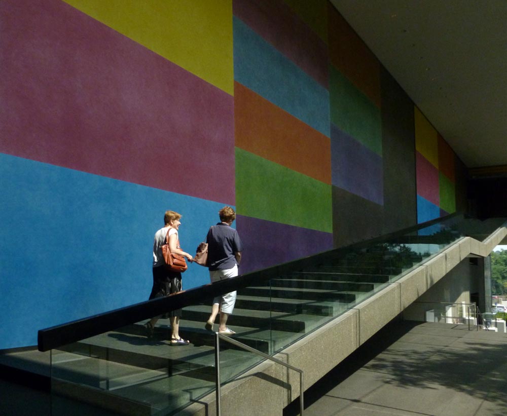 two persons walking up steps