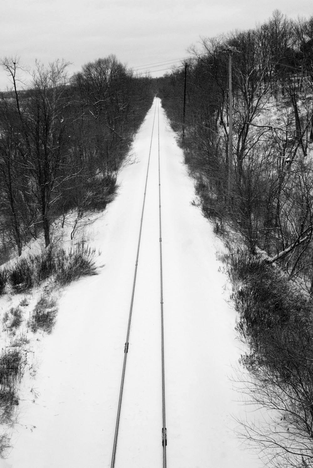railroad tracks in the snow.