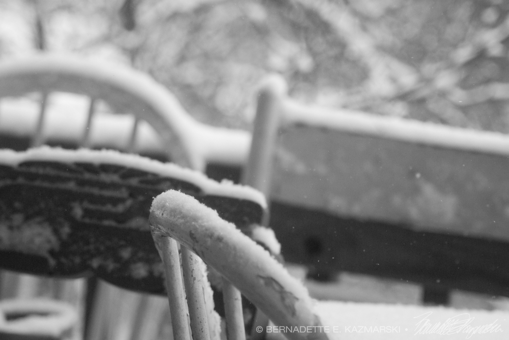 wooden chairs with snow