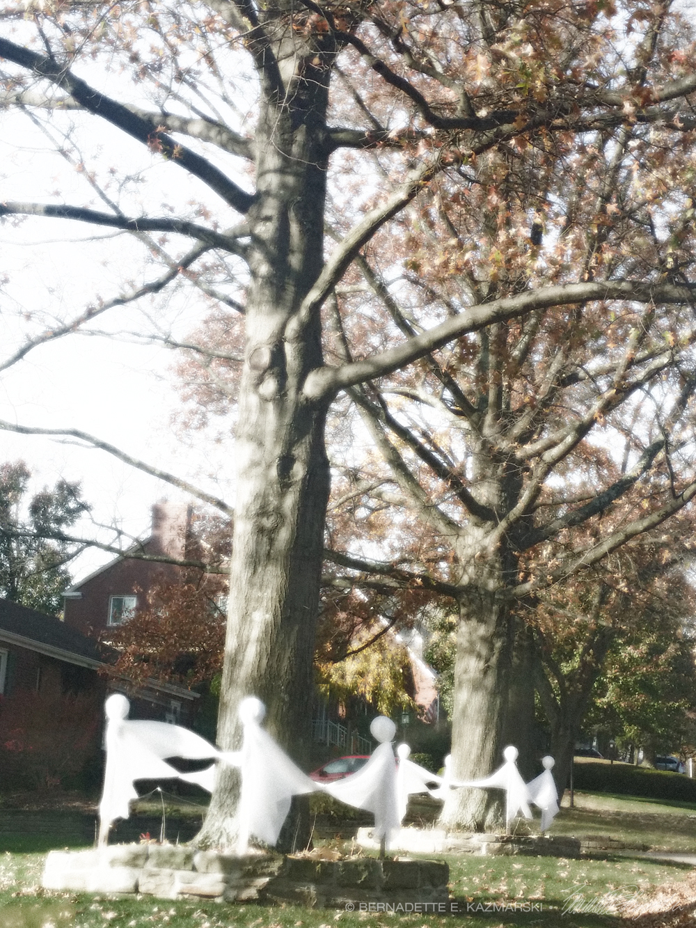 ghosts dance around tree