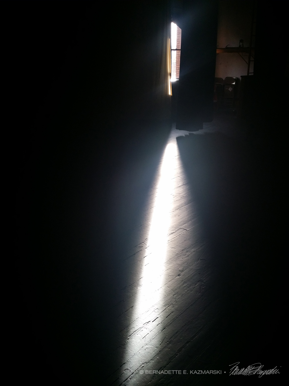 light through window across stage