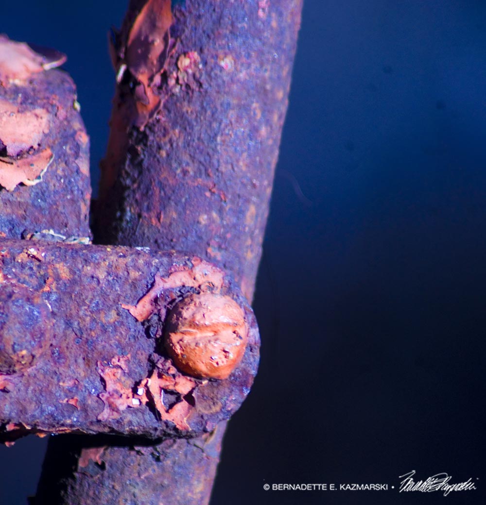 orange paint and orange rust on metal
